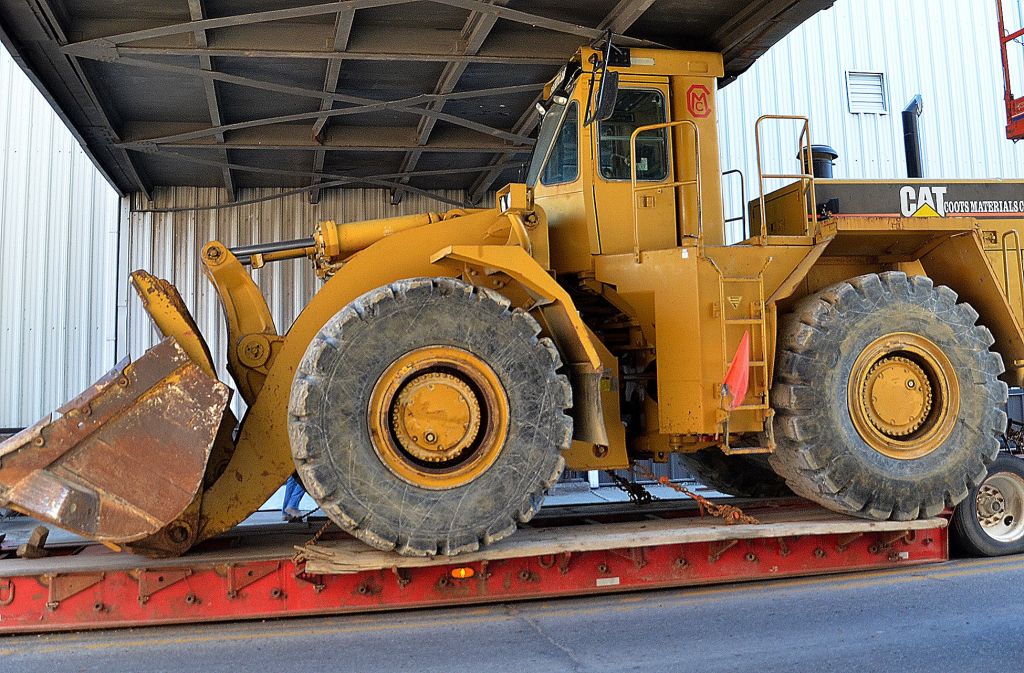Loader hits bridge